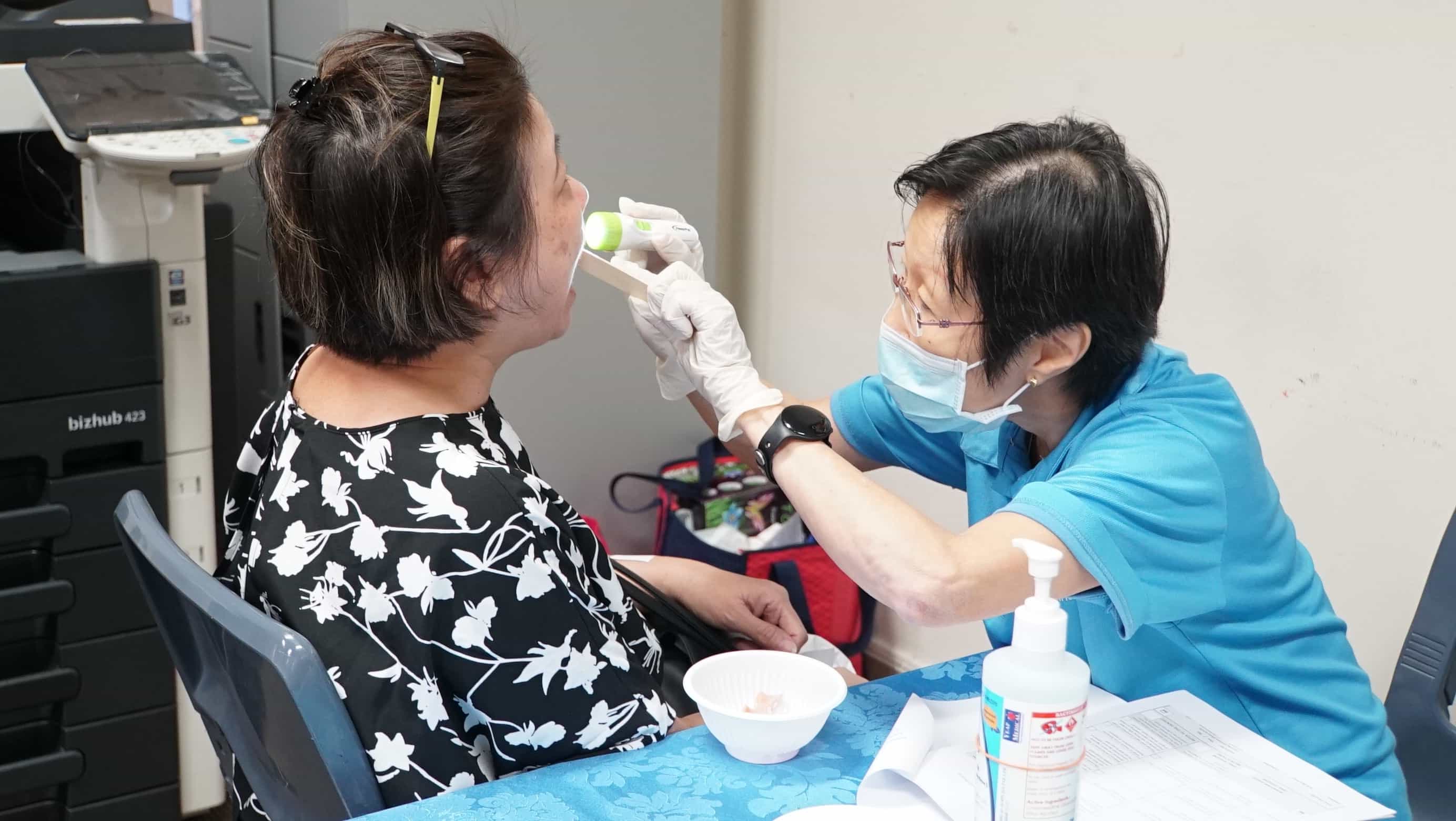 A nurse conducting health checks